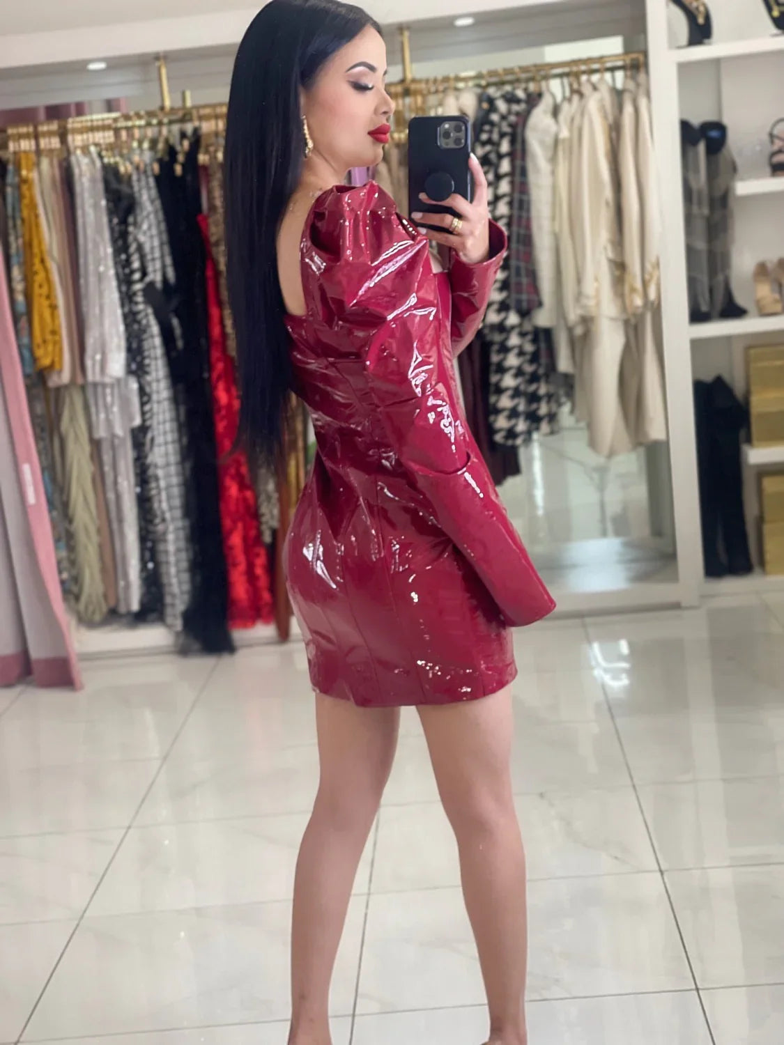Valentina red faux leather long sleeve mini dress with front zipper.