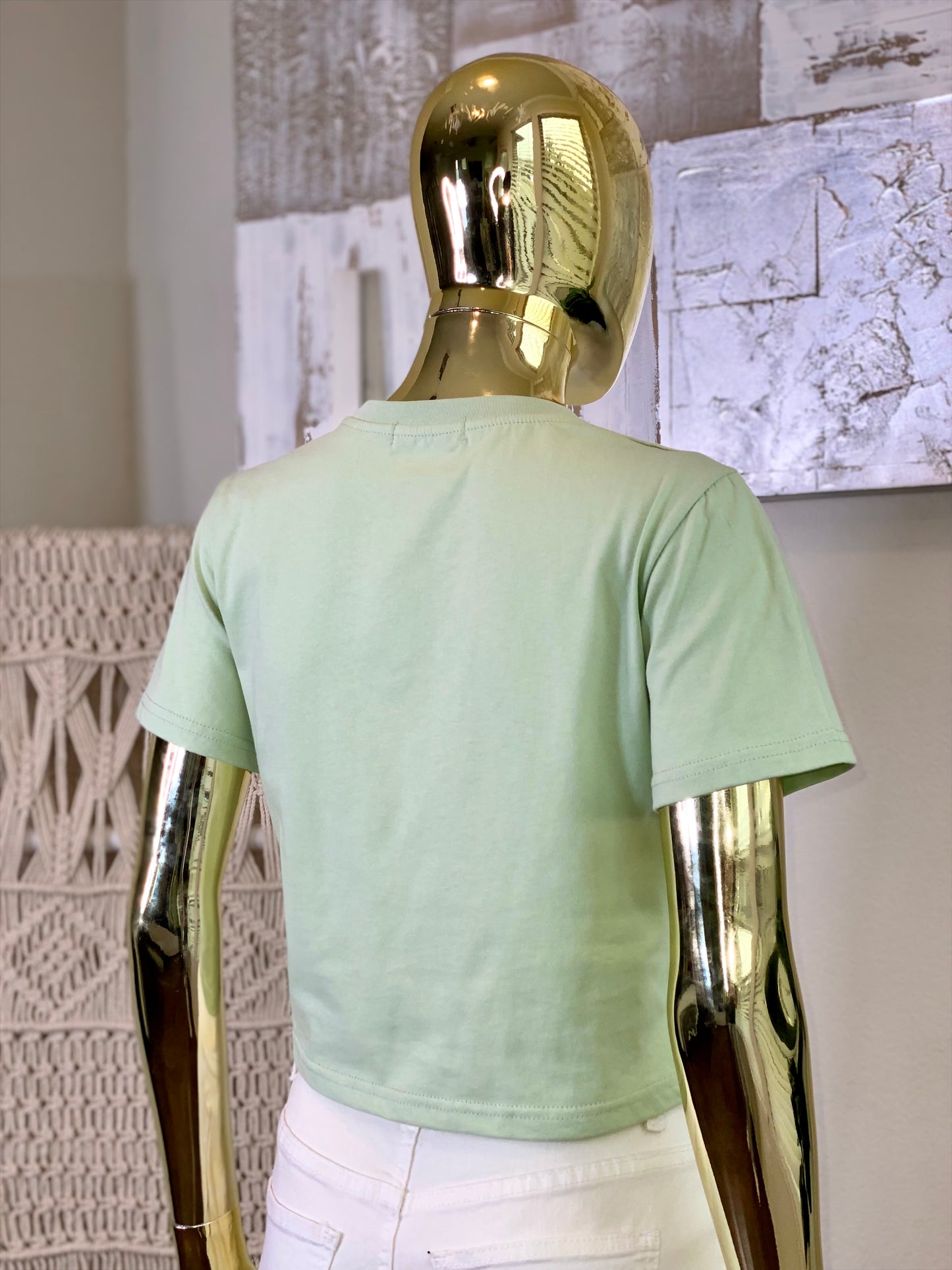 Pistachio Stones Baby Tee, light green short-sleeve top with elegant stone embellishments.