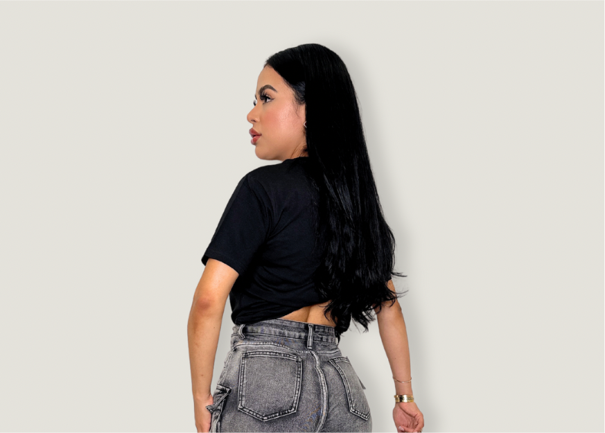 Black Hustling top, semi-stretch casual graphic t-shirt, paired with gray jeans.