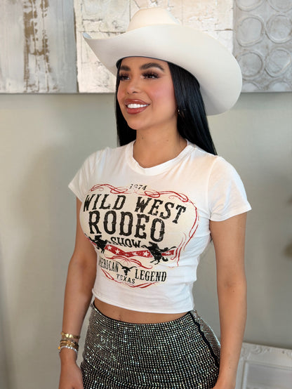 White Wild West Rodeo print crop top with stretch material, paired with a sparkly skirt and white cowboy hat.